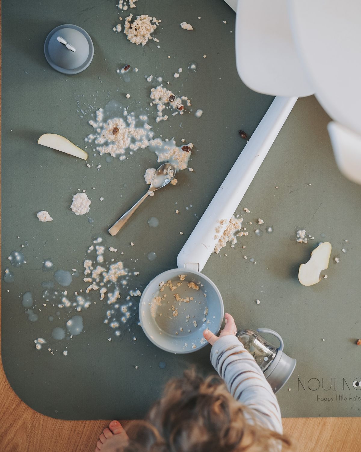 A rectangular dusty olive high chair floor mat laid out flat. Protects all kind of flooring from spills and fluids.