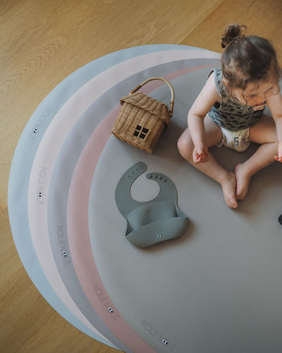 Stylish round floor mats in stylish colors to put under high chair – protects floors during baby mealtime