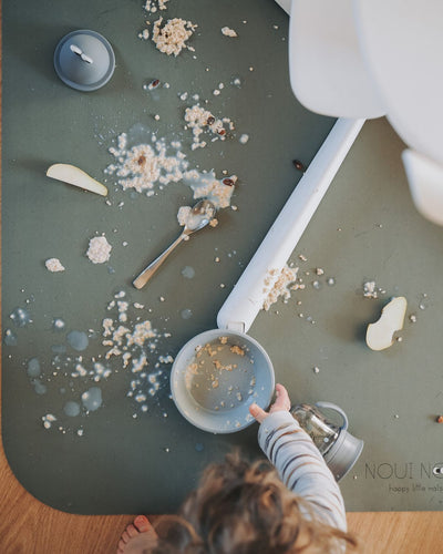 A rectangular dusty olive high chair floor mat laid out flat. Protects all kind of flooring from spills and fluids. 