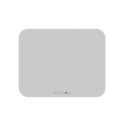 A rectangular grey powder color placemat. Perfect to protect the table surface from spills and scratches.