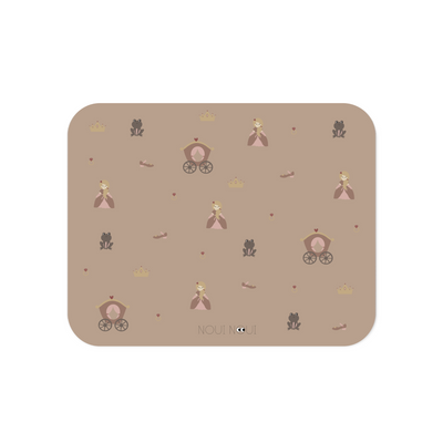 A placemat with a princess-themed pattern including illustrations of princesses, castles, and hearts in pink tones.