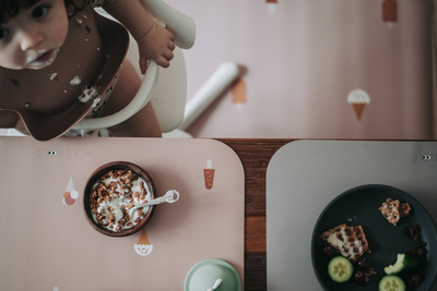 Placemat with old rose background with different ice cream in stylish rose tone in tone. Paired with our floor mat under a high chair.