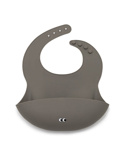 A warm gray soft silicone bib with adjustable straps and a large cup for catching food.