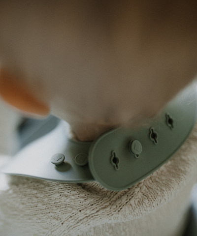 Closeup of the adjustable strap seen on a child. 